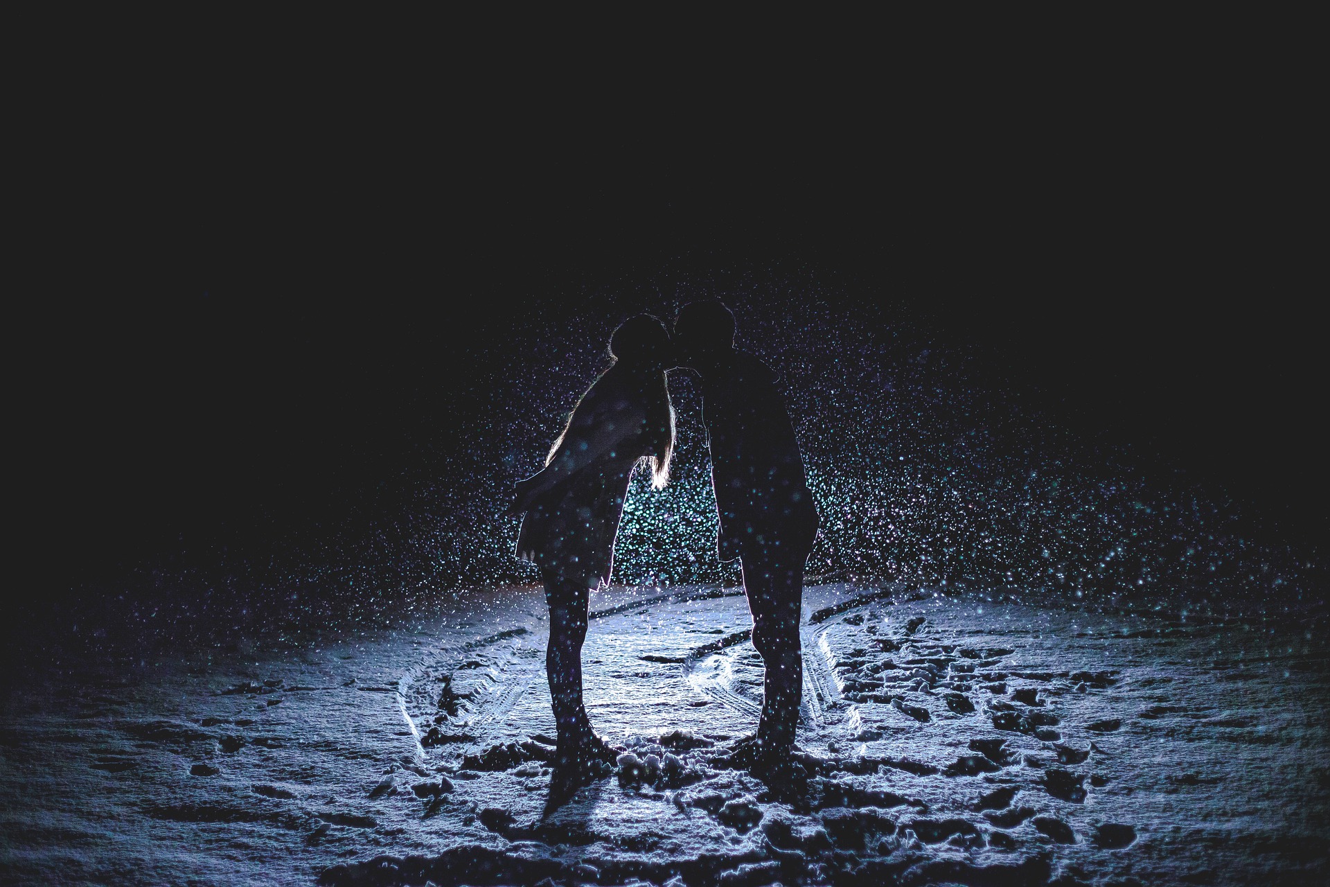 Couple kissing in snow