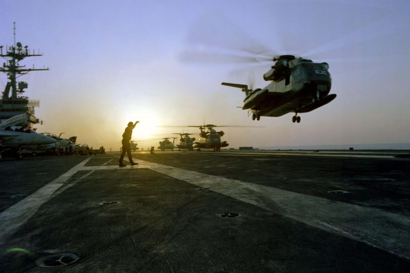 Military helicopters leave US naval vessel