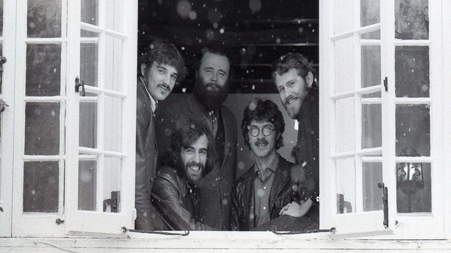 The Band posing in window frame