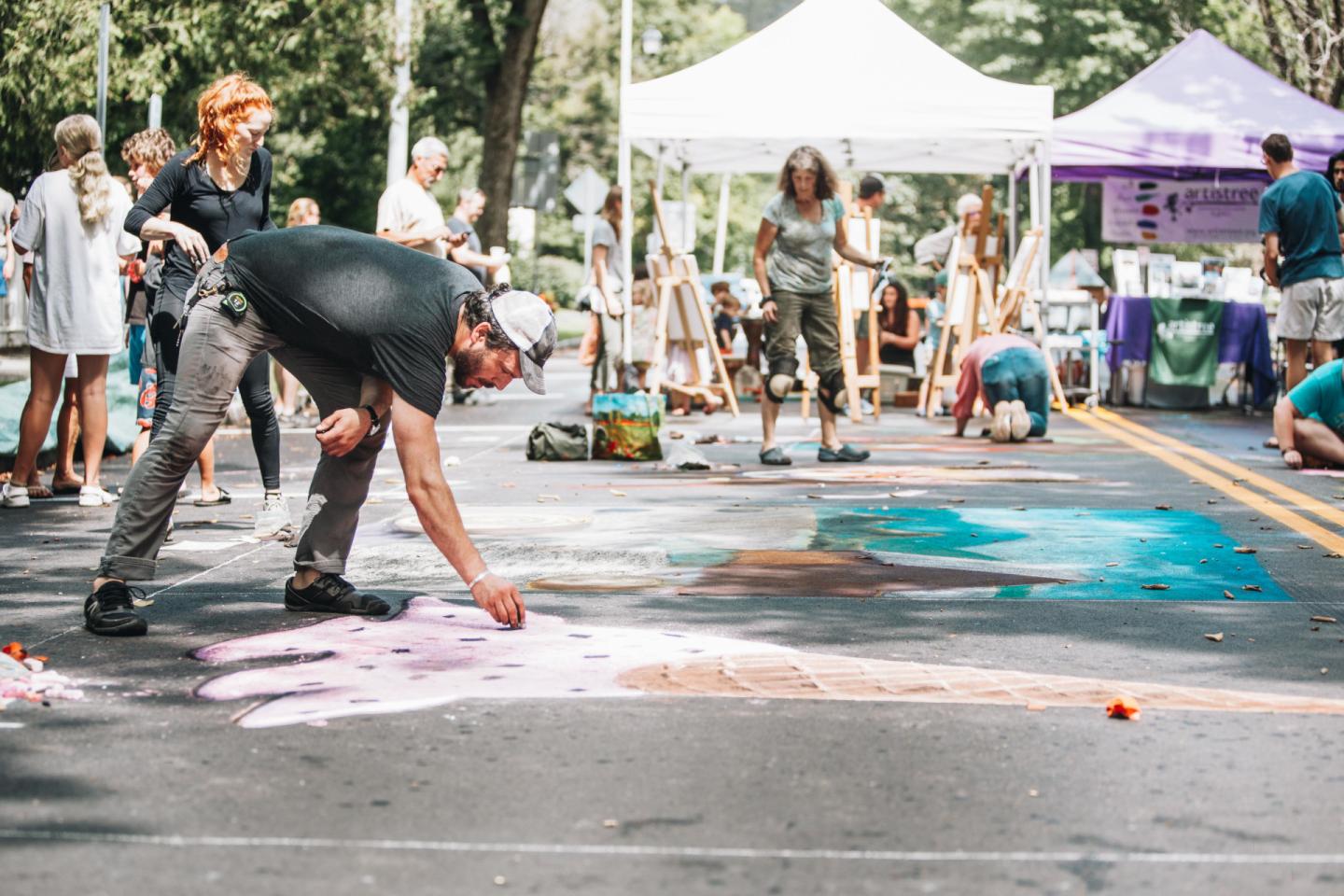 Artist working at Taste of Woodstock