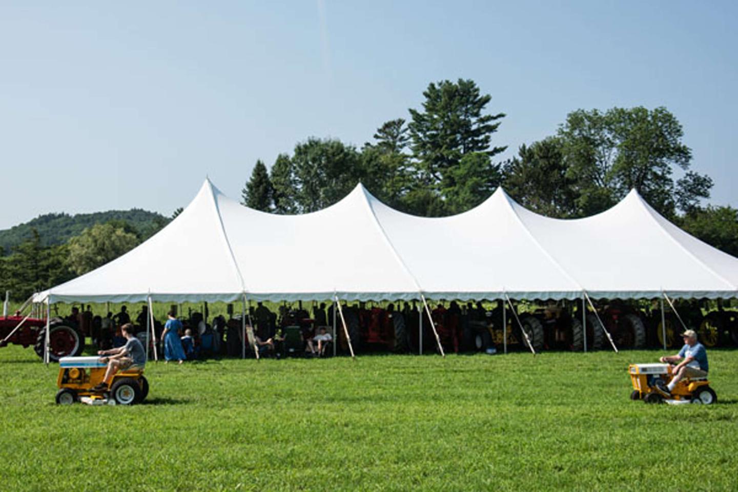 Lawn tractors in parade.