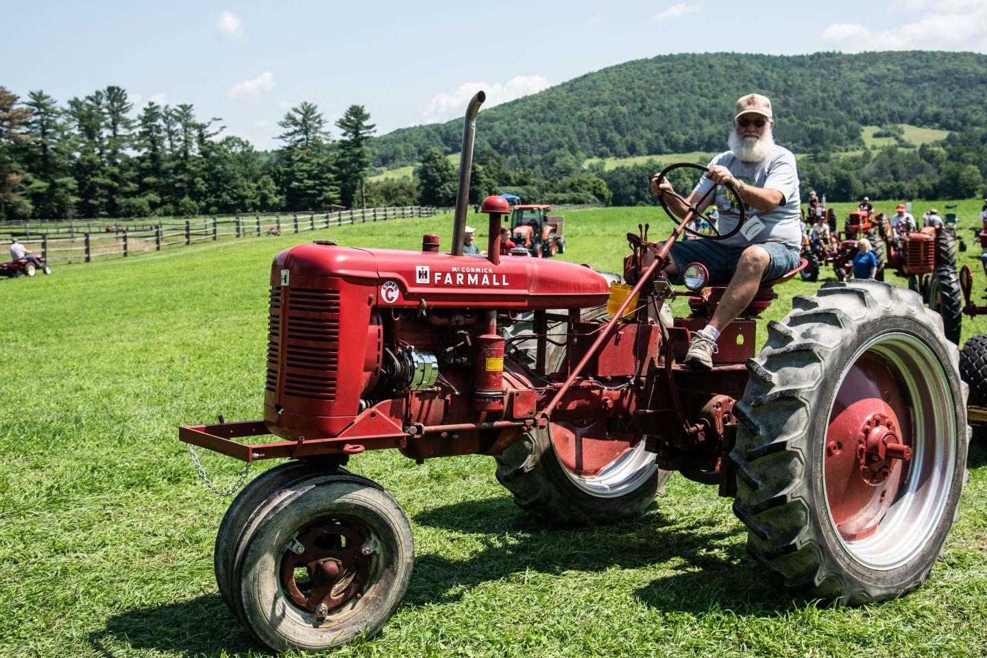 Antique tractor driving.