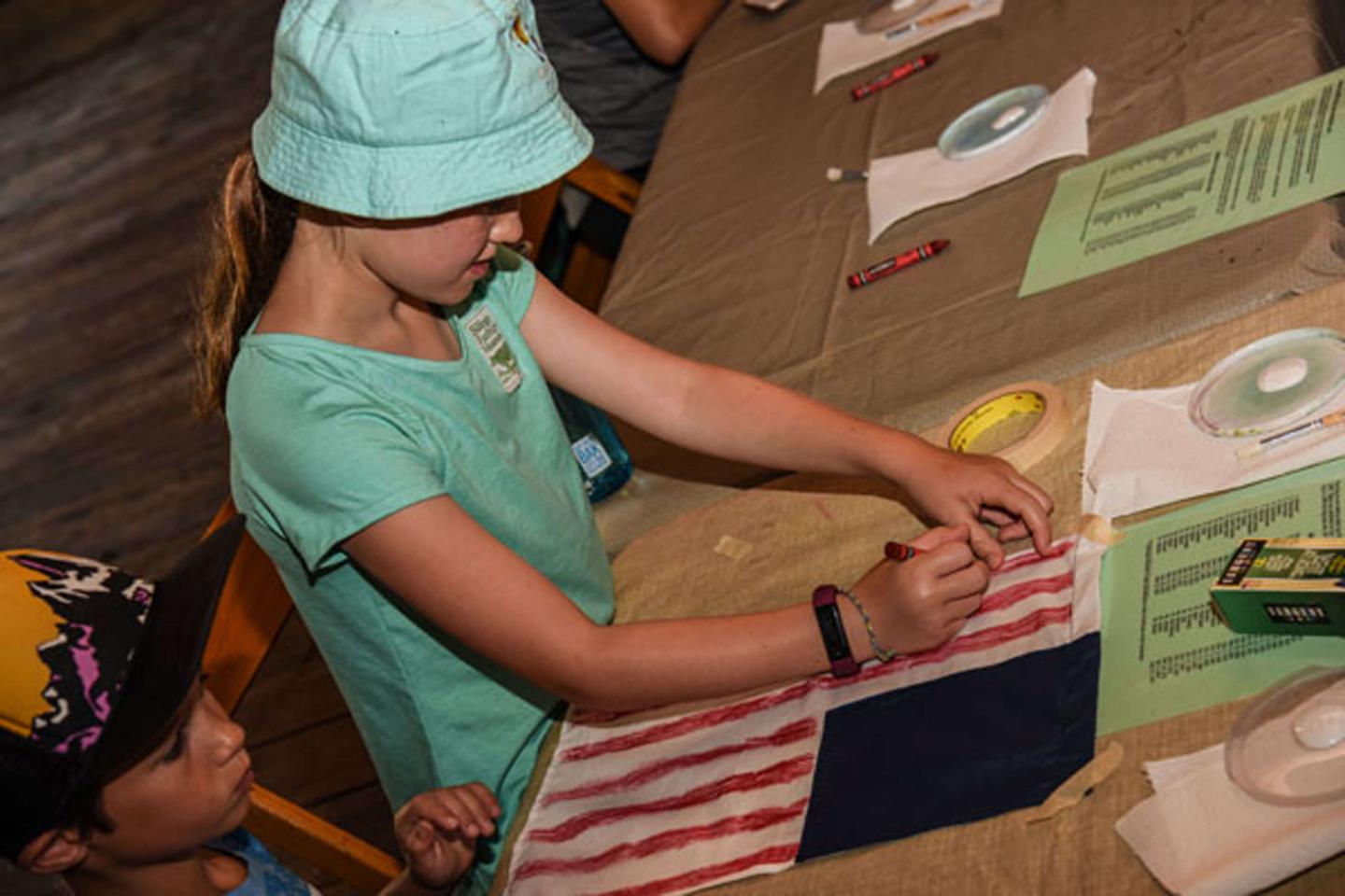 Girl making a flag.