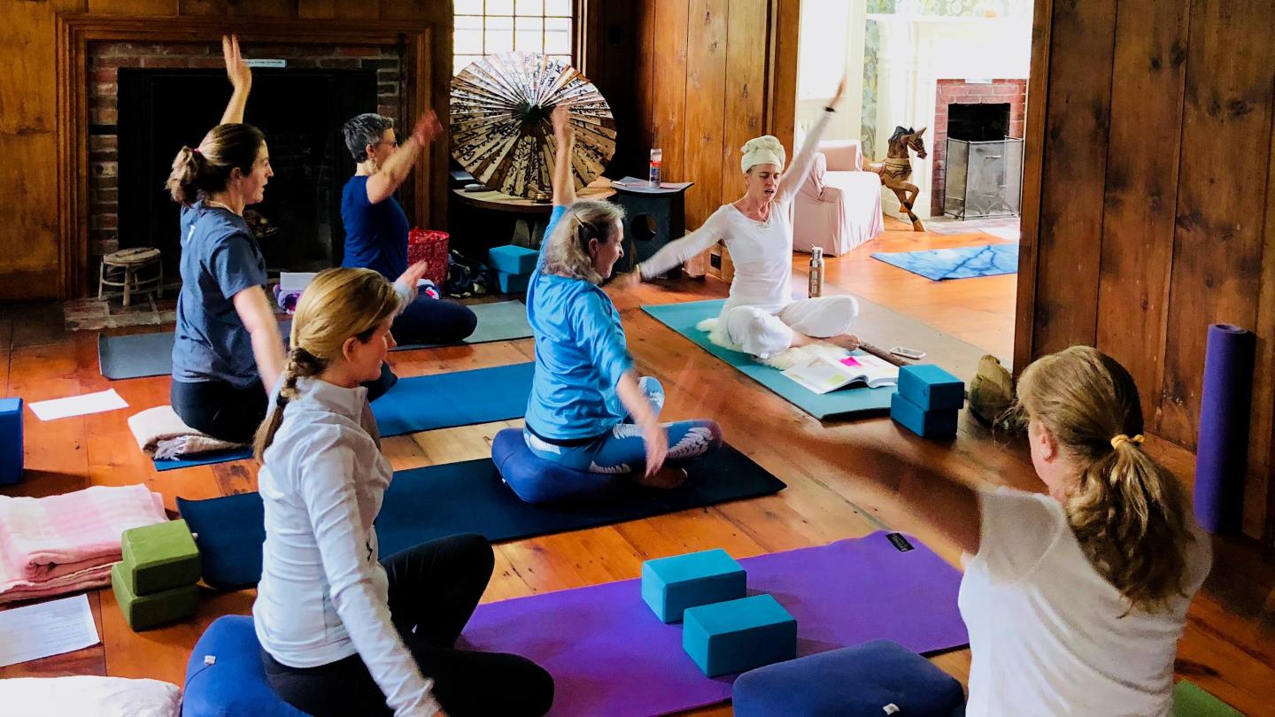 Miss Amanda leading yoga students
