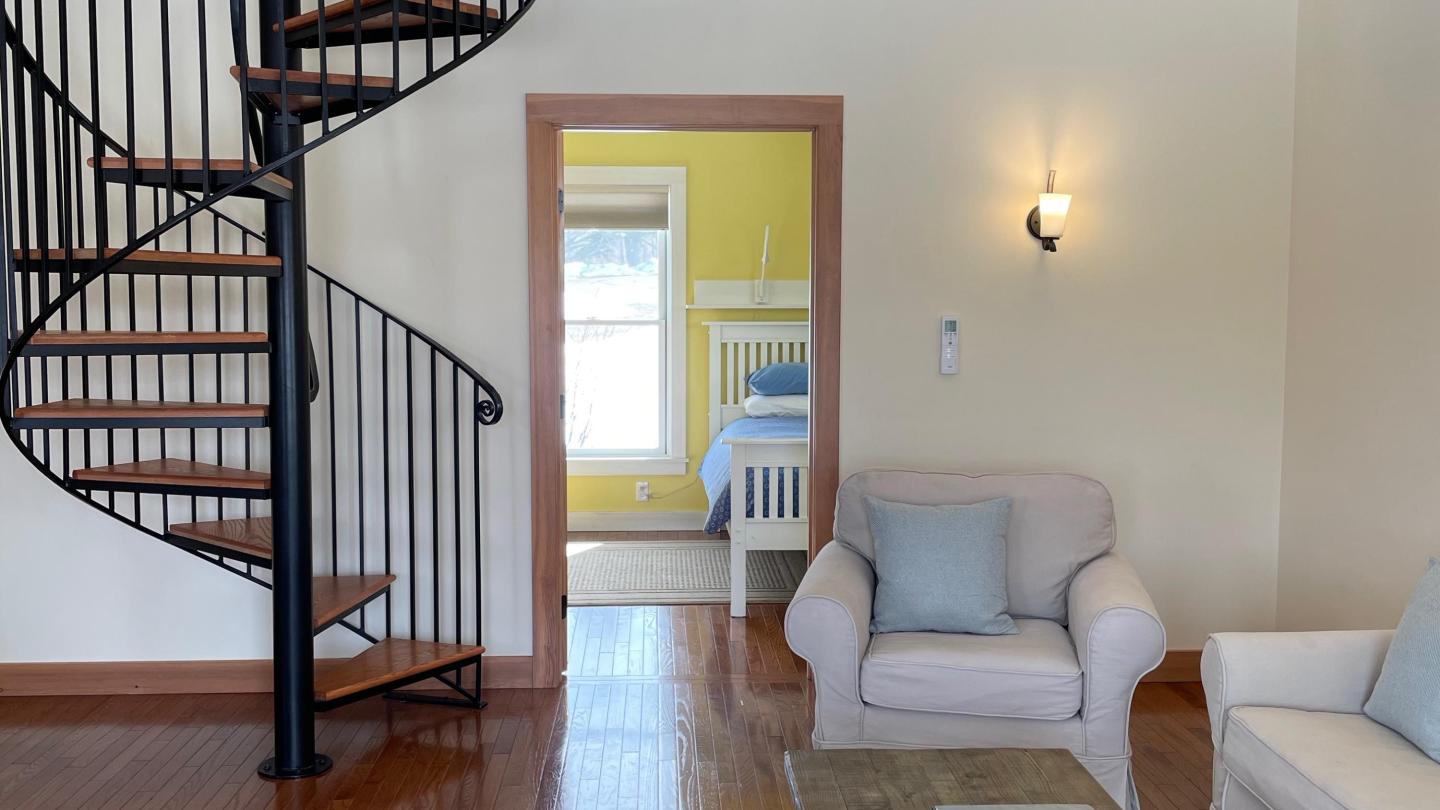 Living area with spiral staircase