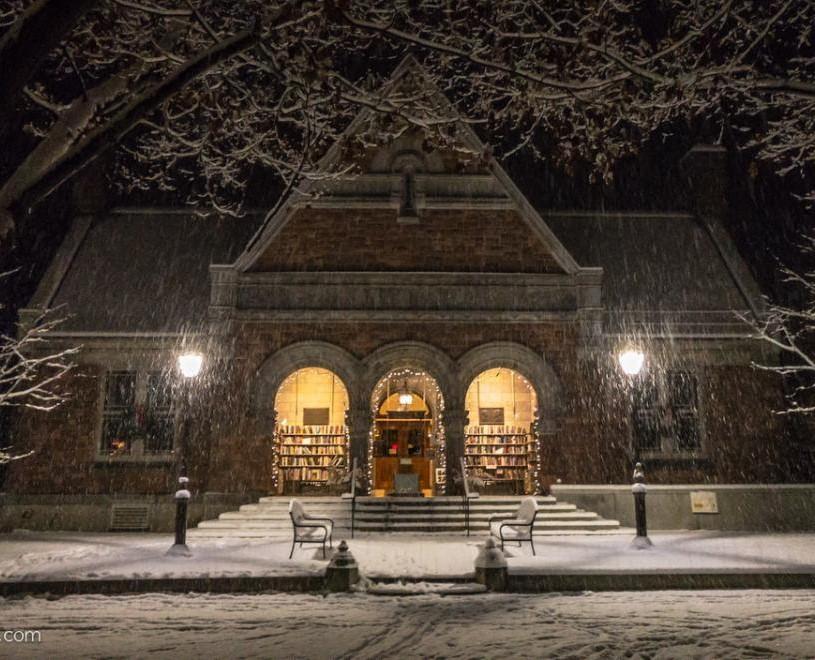 Norman Williams Public Library in the snow at night