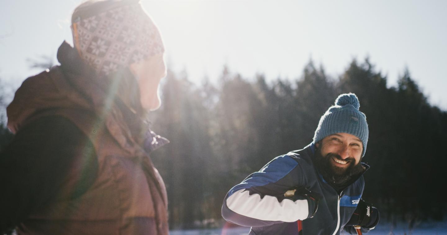 Two people in ski gear smiling