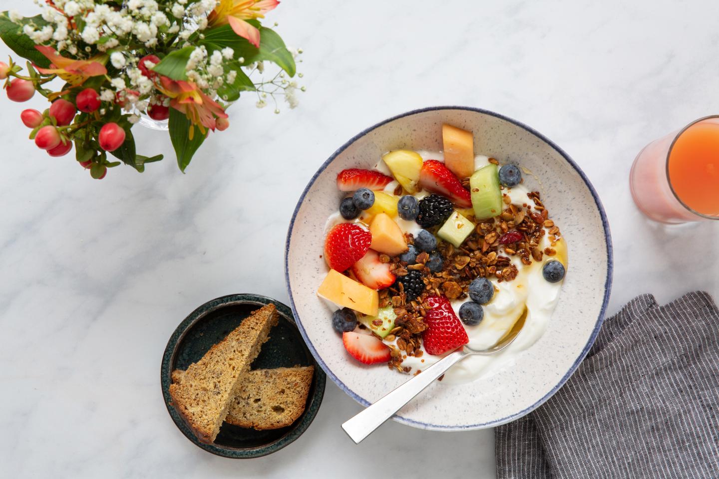 Bowl of yogurt with fruit and granola