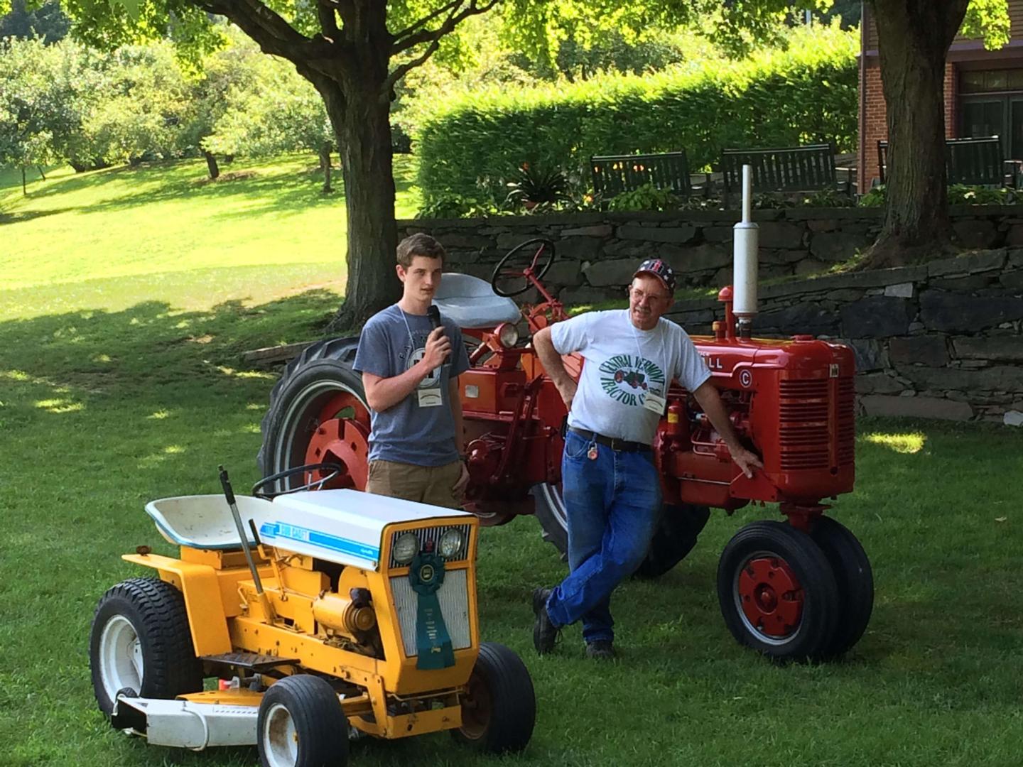 Two locals talking about tractors.