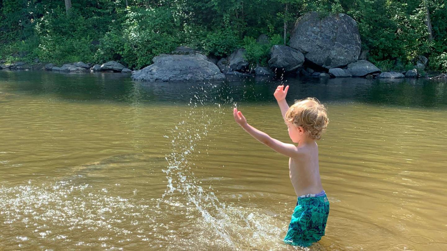 boy splashing in water