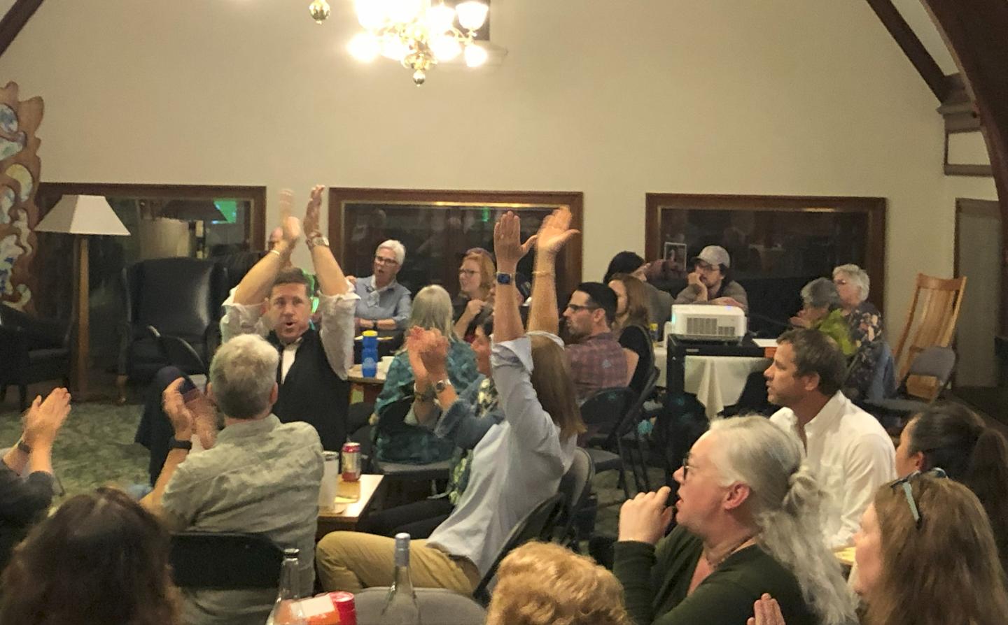 Trivia team cheering when they won a round.