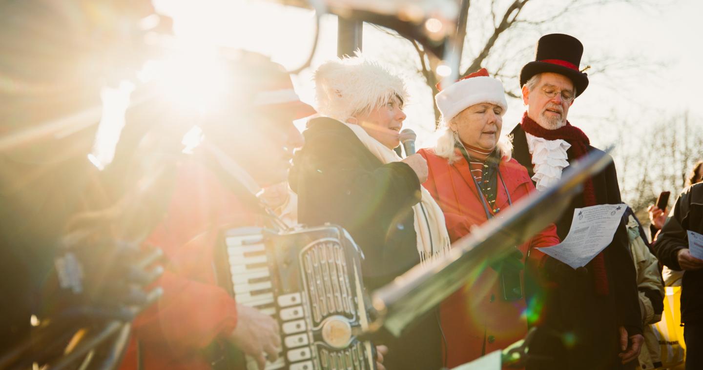 Carolers singing on the Woodstock VT town green during Wassail Weekend
