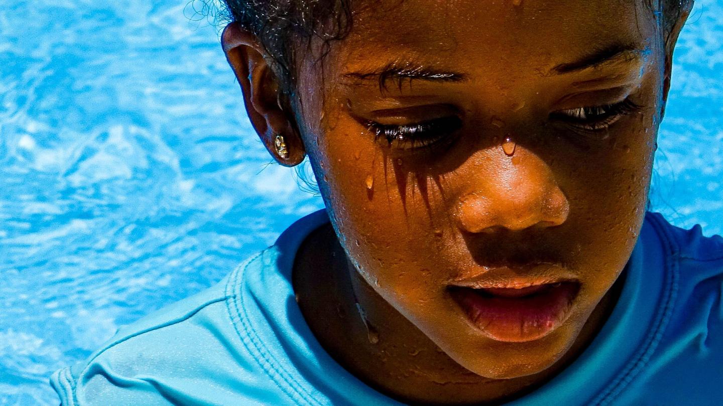 Child swimming in the pool