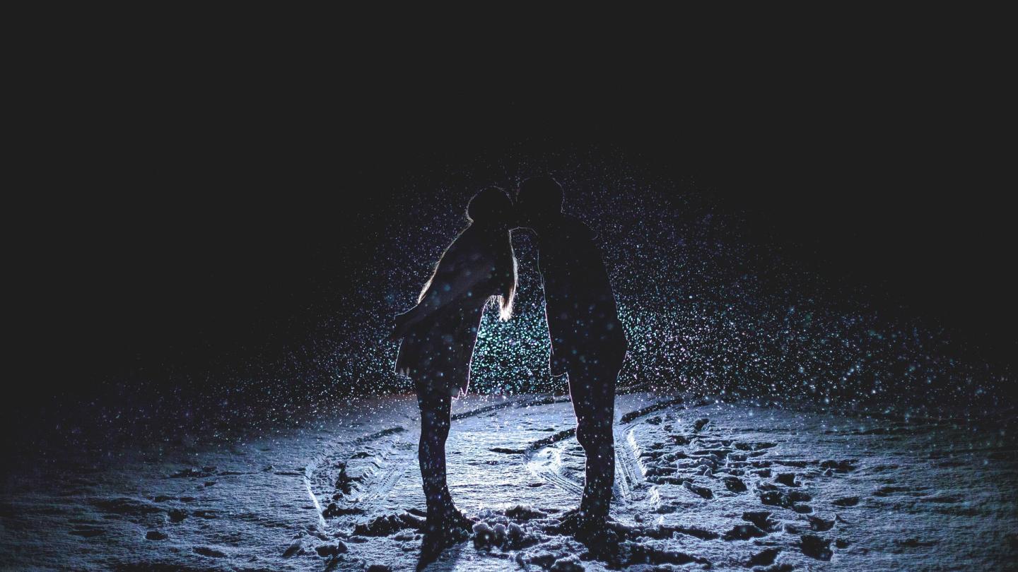 Couple kissing in snow