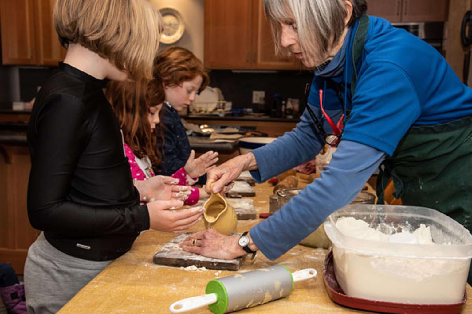 Children learning to make pastries.