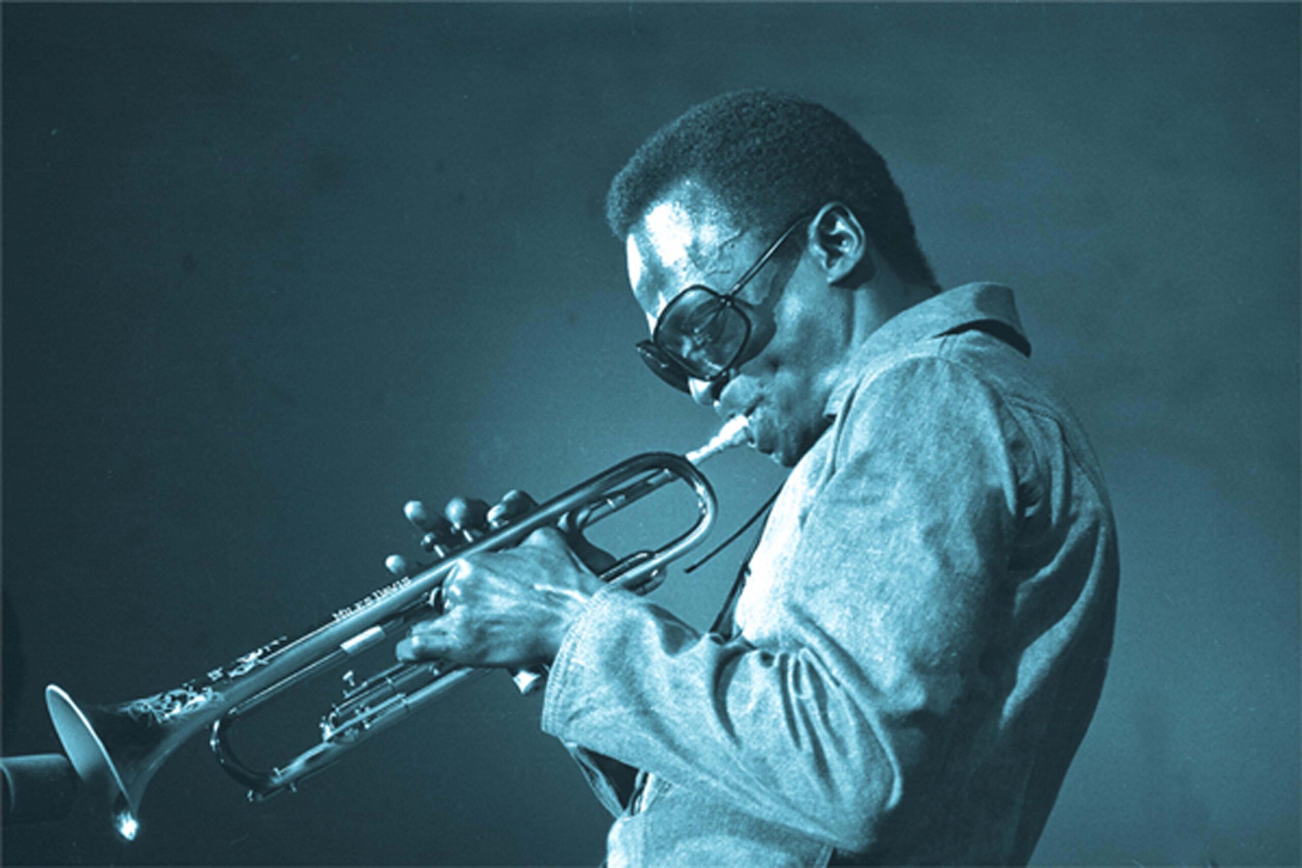 Miles Davis playing the trumpet.