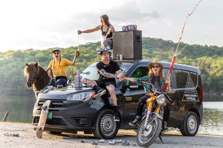 crew of abracadabra with merchandise 