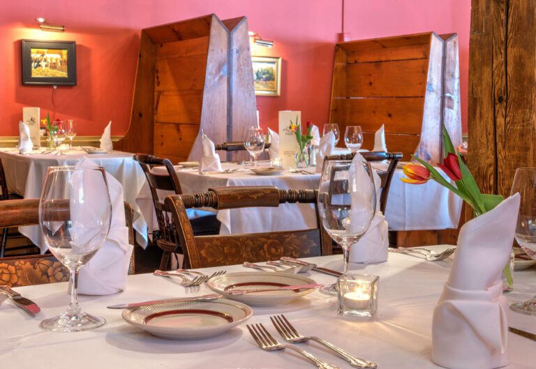 A view of tables and booths in our main dining room.