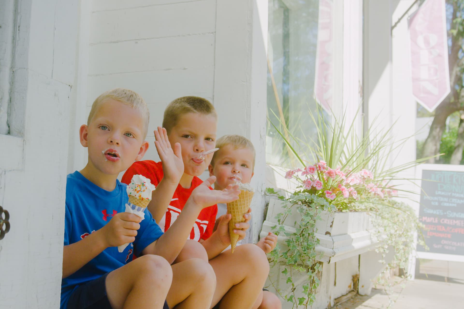 Three boys eating ice cream