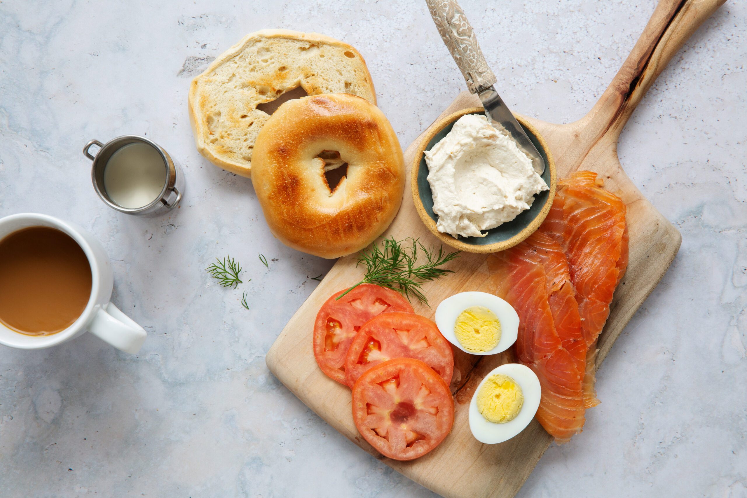 Smoked Salmon board with a bagel, tomato, hard boiled egg