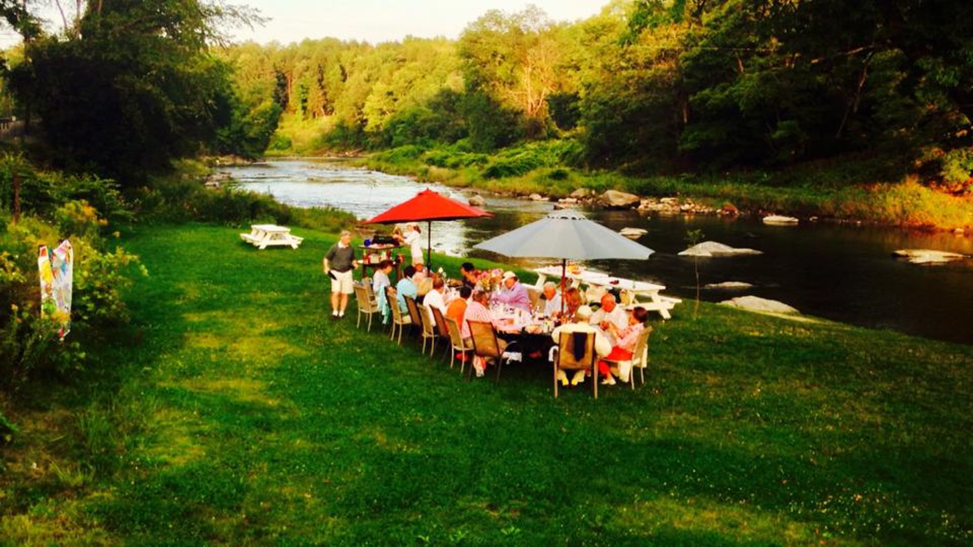 white cottage by the river