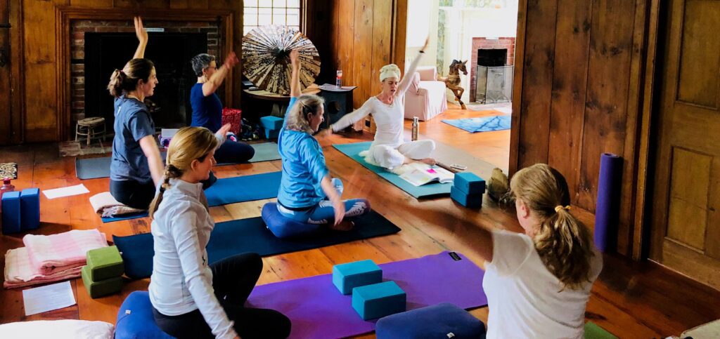 Miss Amanda leading yoga students