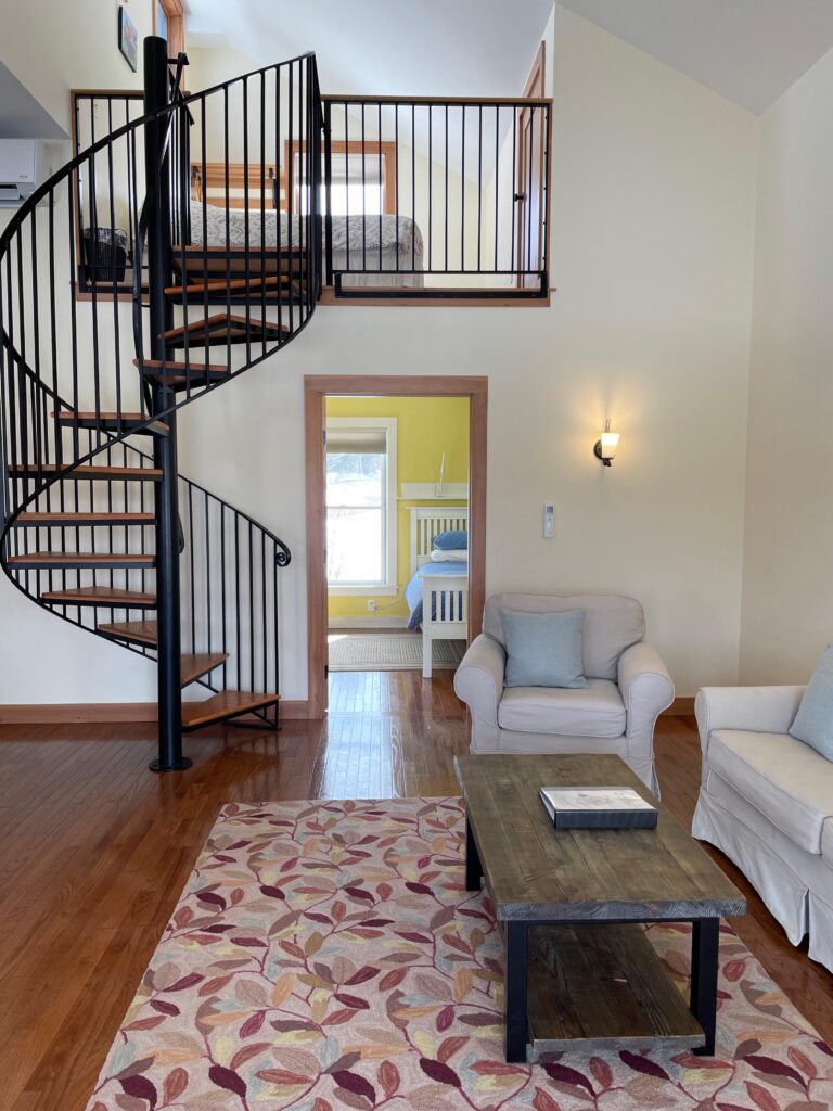Living area with spiral staircase