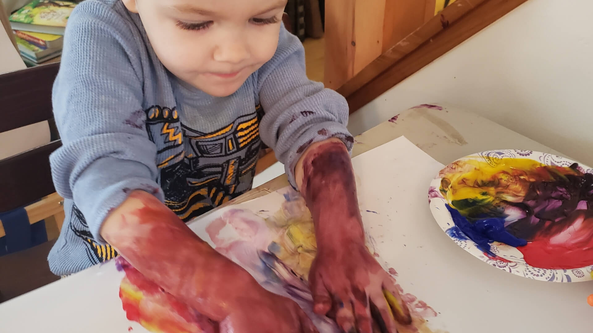 Laura White Pottery Ethan making art 