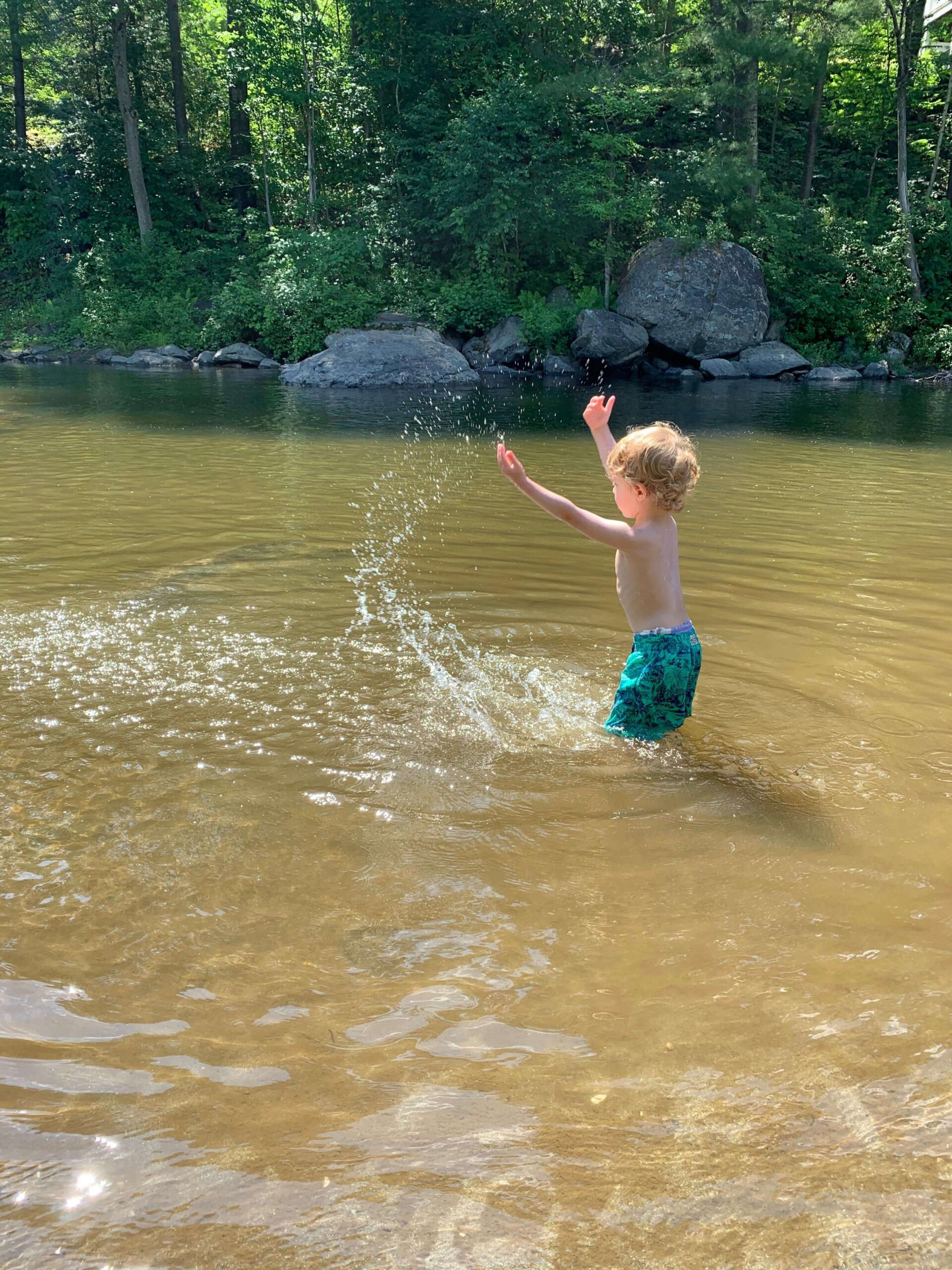 boy splashing in water