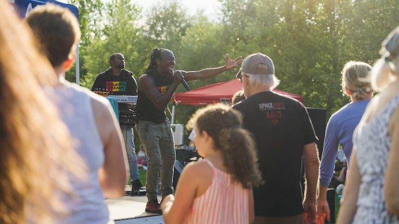 Performer singing at the East End concert series.