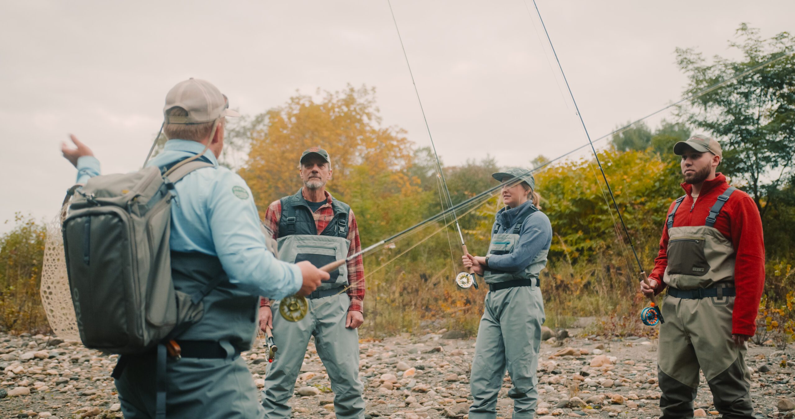 Group of men fly fishing