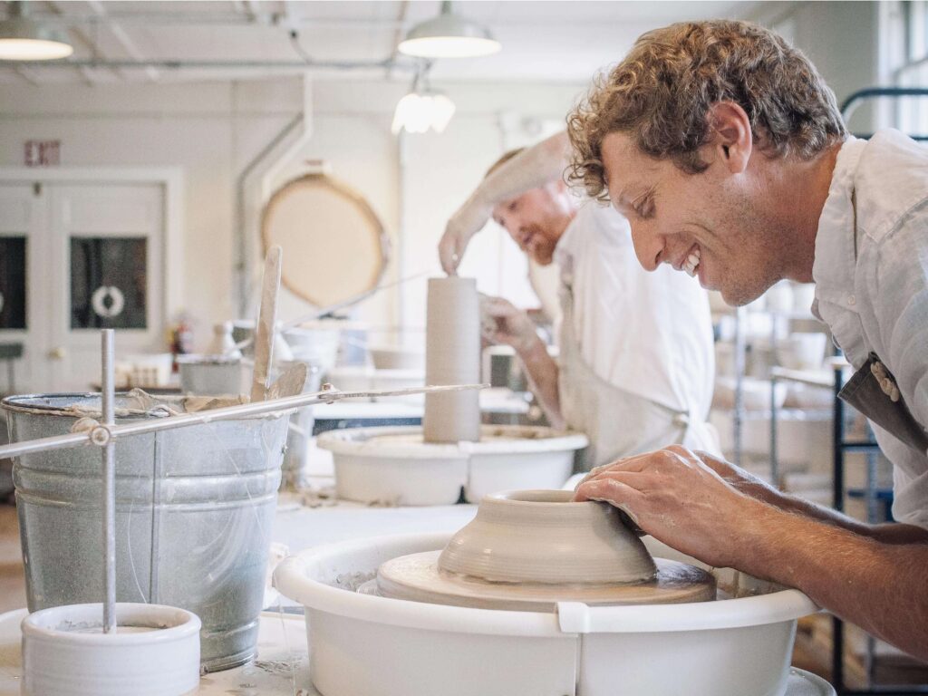 James Zilian of Farmhouse Pottery at the pottery wheel