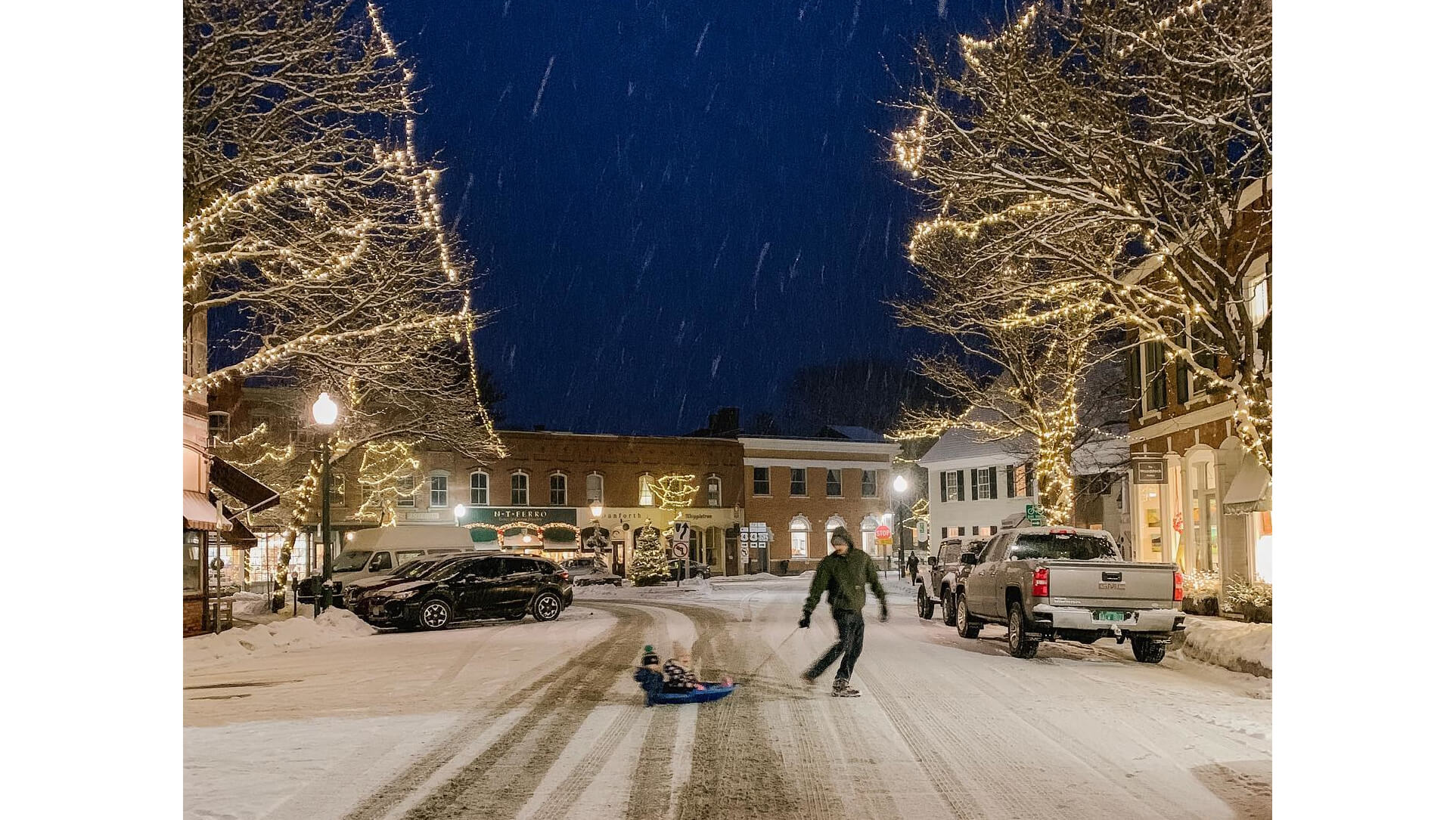 The Schmidtke family sledding through town