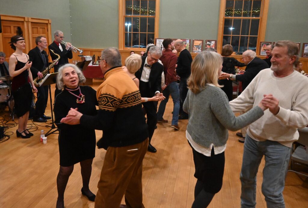 A lively, festive dancefloor scene at the Cabaret