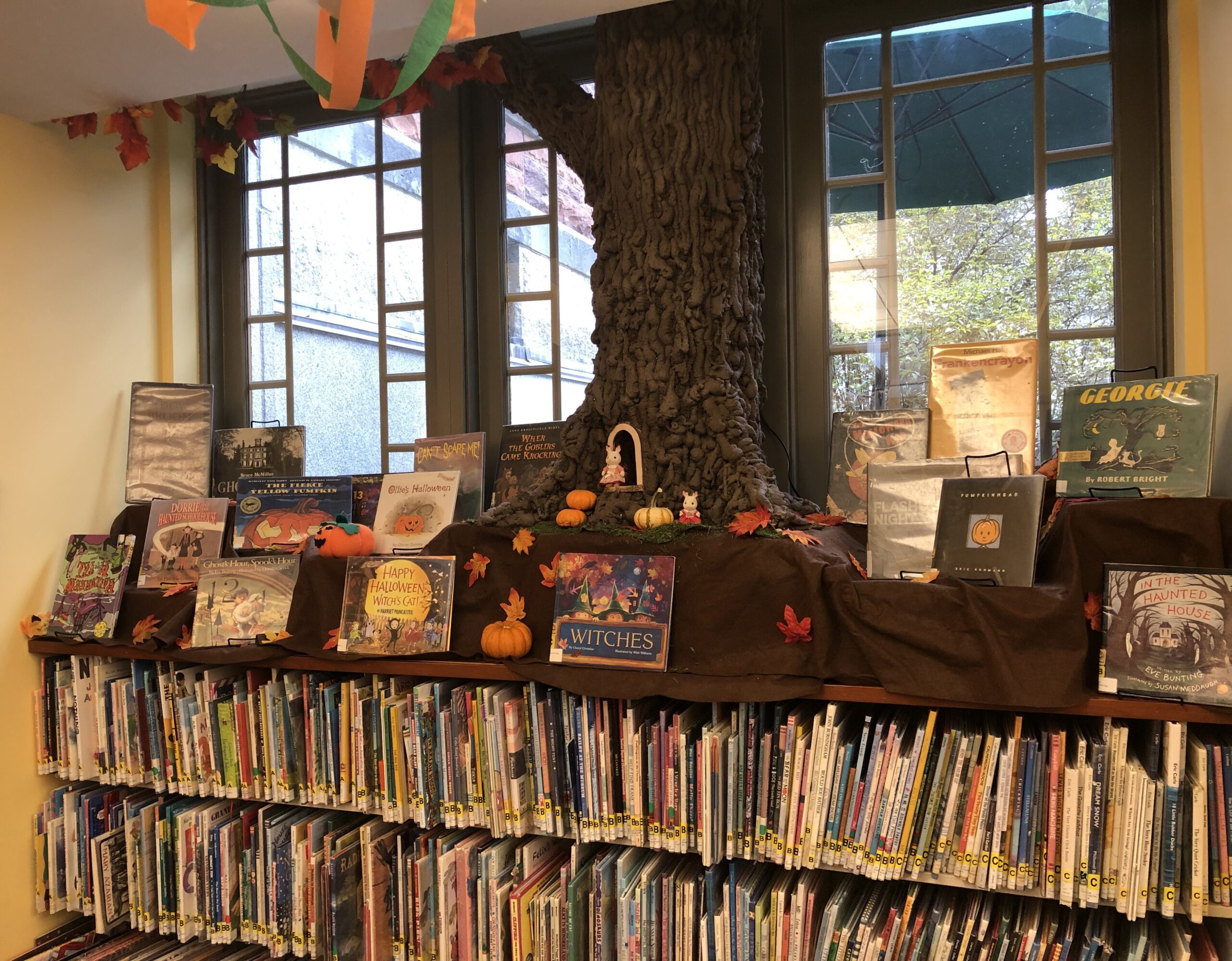 Tree display with picture books in library
